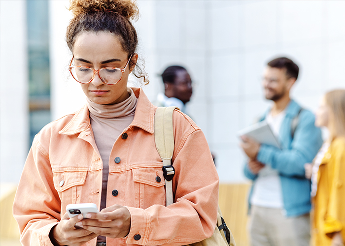 A student is aware of 5 common financial scams thanks to tips from UW Credit Union