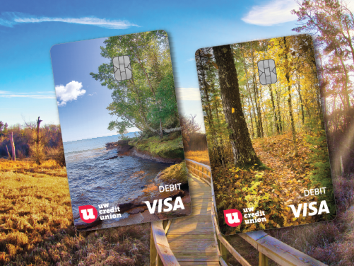 An image featuring two new nature inspired UW Credit Union debit card designs over a boardwalk trail backdrop. 