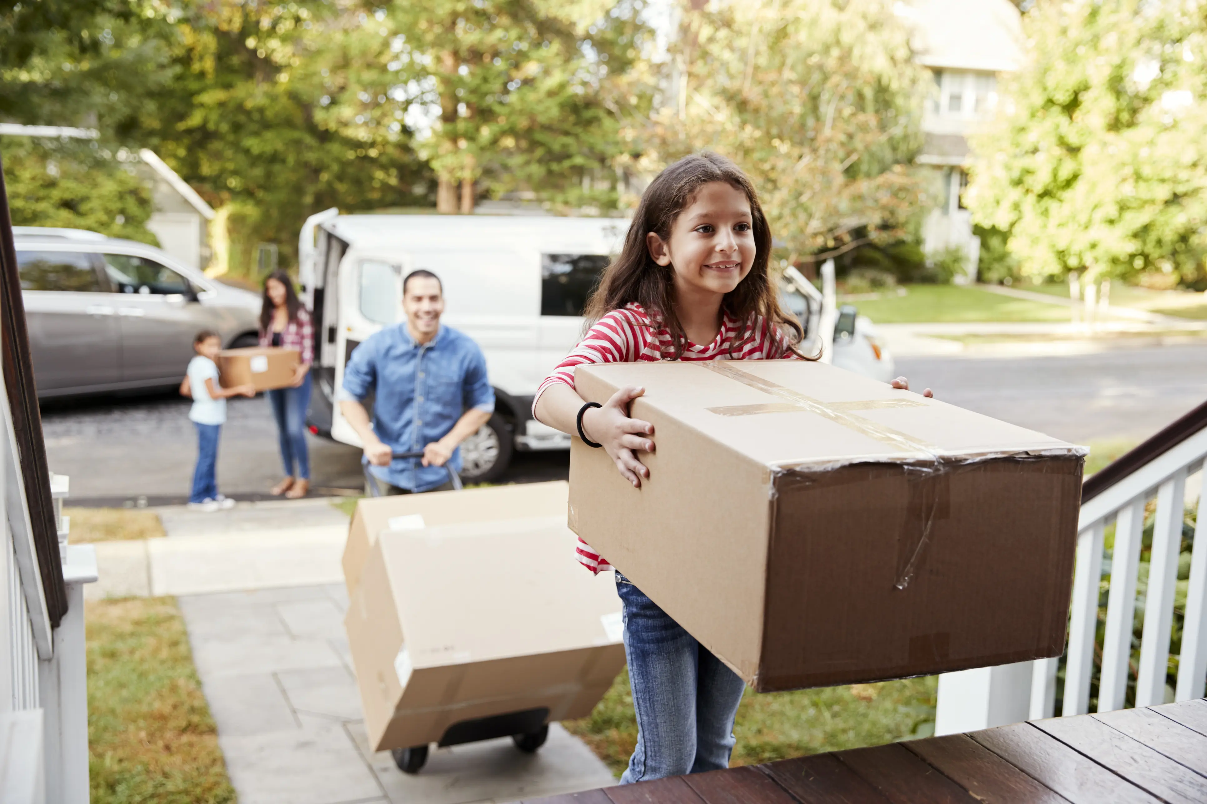Family moving into their new house, financed by a mortgage home loan from UW Credit Union