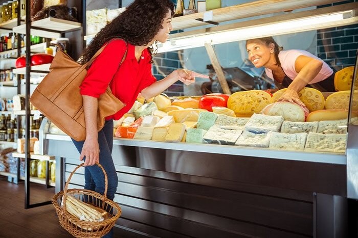 woman shopping after choosing whether a checking or savings account was best
